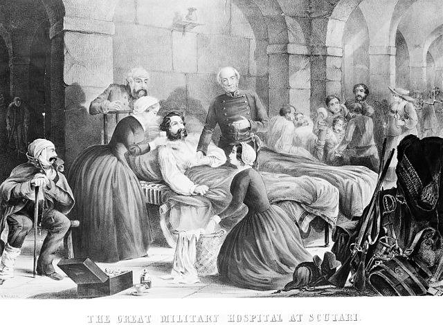 Florence Nightingale and her staff nursing a patient in the military hospital at Scutari. Coloured lithograph, c. 1855, by T. Packer after himself.