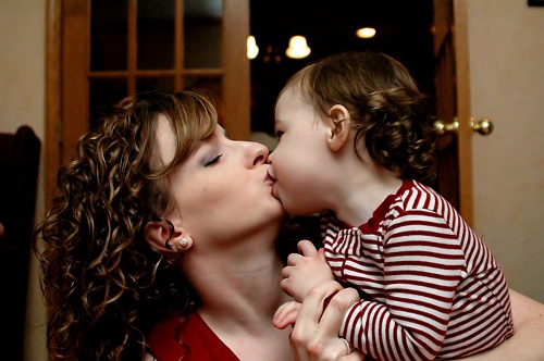 kissing baby on mouth