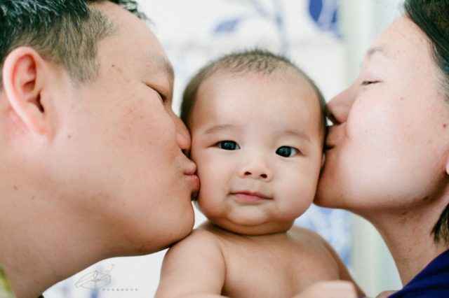 mom and dad loving baby